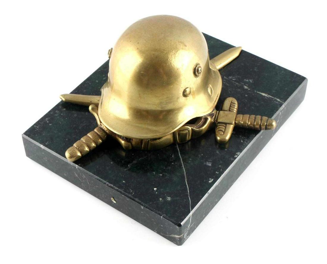 WWII GERMAN 3RD REICH ARMY BRONZE TABLE DISPLAY: WWII German army bronze table display. Features a gilded bronze helmet with swords crossing. Measures 4.5 X 5.5 inches. Very good condition. Unauthenticated; sold as is.This lot has a reserve.