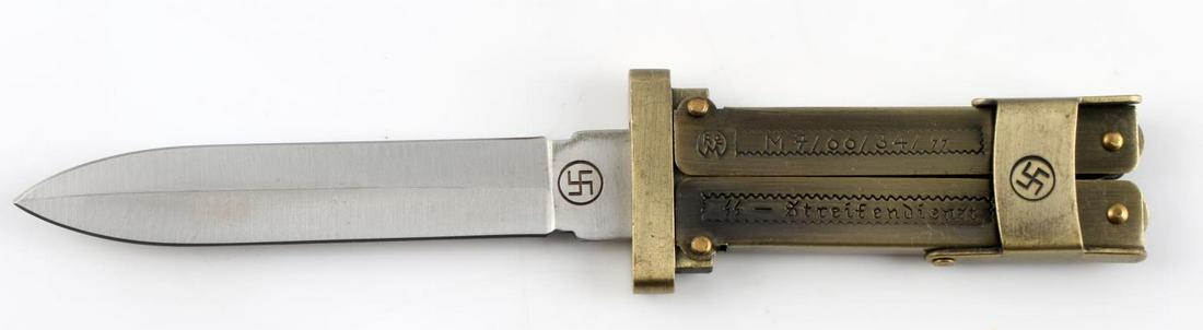 WWII GERMAN WAFFEN SS PARATROOPER FOLDING KNIFE: WWII German Waffen SS Paratrooper knife. Brass construction with a stainless steel blade. Blade has swastika at cross guard and "Stainless China" to opposite side. Grip engraved RZM M 7/66/34/SS and S