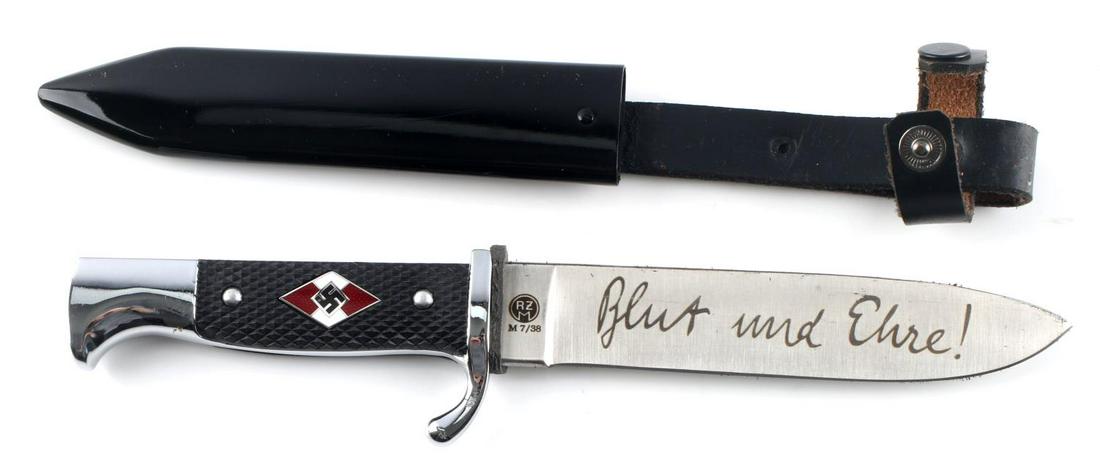 WWII GERMAN HITLER YOUTH HJ DAGGER WITH SCABBARD: WWII German Hitler Youth HJ dagger with scabbard. HJ diamond to black checkerboard plastic grip. 5 3/8 inch blade etched "Blut und Ehre!" and maker marked same side "RZM M7/38". Black nickel scabbard 