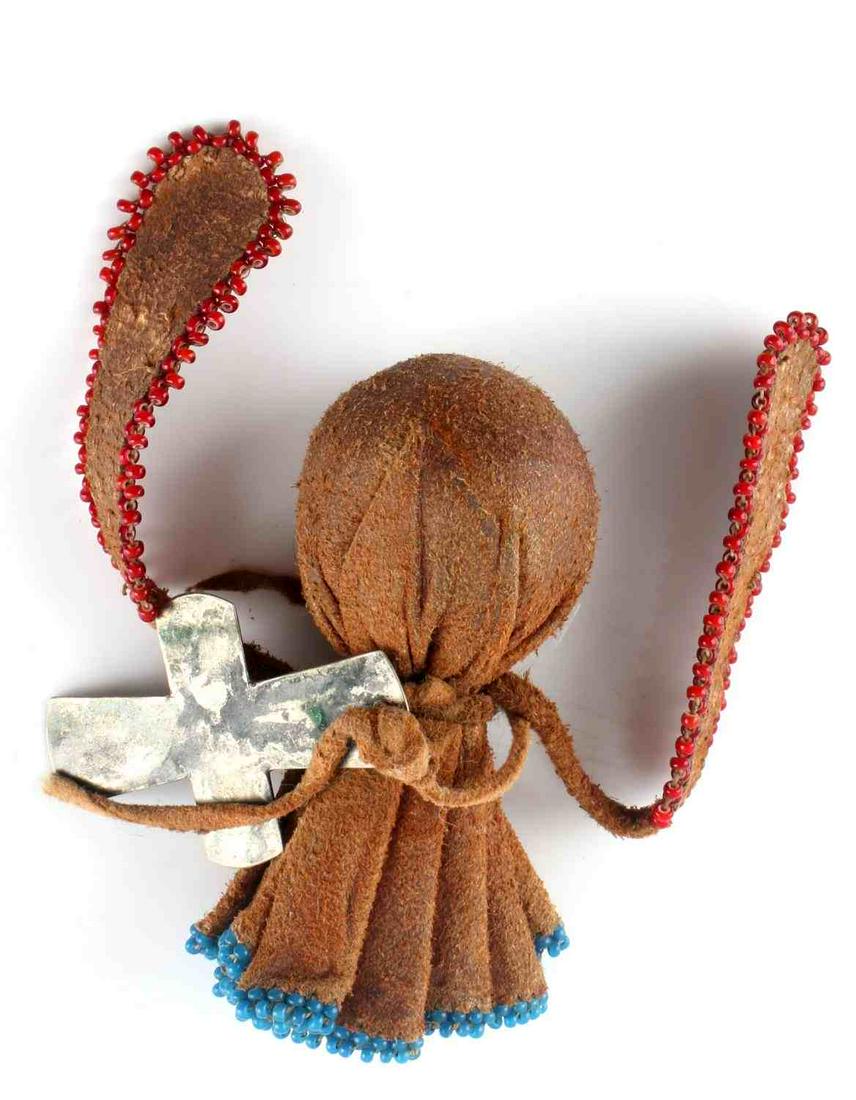 ANTIQUE NATIVE AMERICAN SMALL BEADED MEDICINE BAG: Antique Native American small medicine bag with beaded edge. Made of leather with blue beads to the edge. Leather tie around the middle with red beads to the edge. Small medal cross tied on by a leath