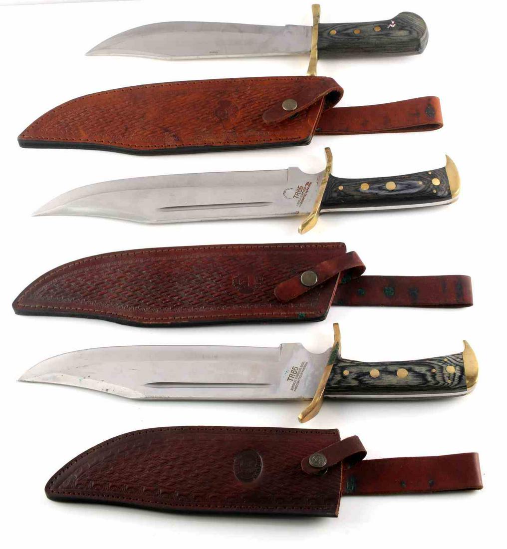 LOT OF 3 LARGE BOWIE KNIVES PAKISTAN W SHEATHS: Grey wood grain grips with brass rivets and fittings, 11 inch blades, one marked Chipaway Cutlery and Pakistan with matching sheath, other two are marked TR65 Timber Rattler, made in Pakistan, with ma