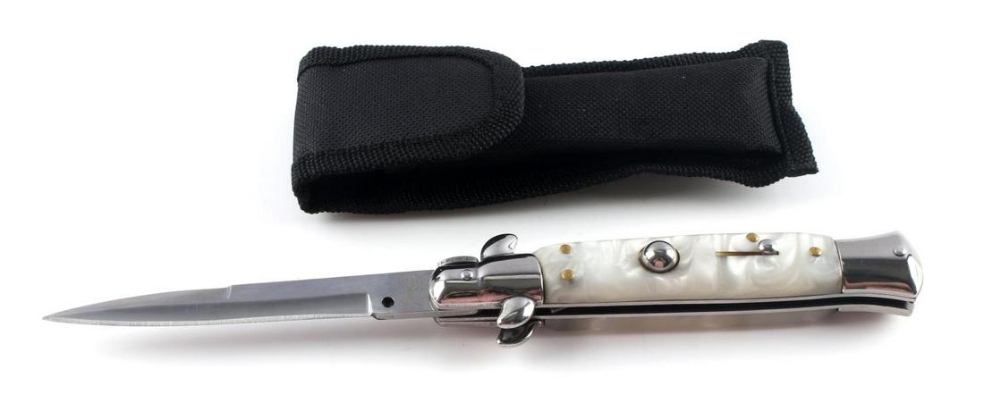 ITALIAN MADE AKC SWITCHBLADE KNIFE MOTHER PEARL: AKC switchblade knife with mother of pearl grips with soft case. 9 inches long. Very fine condition.