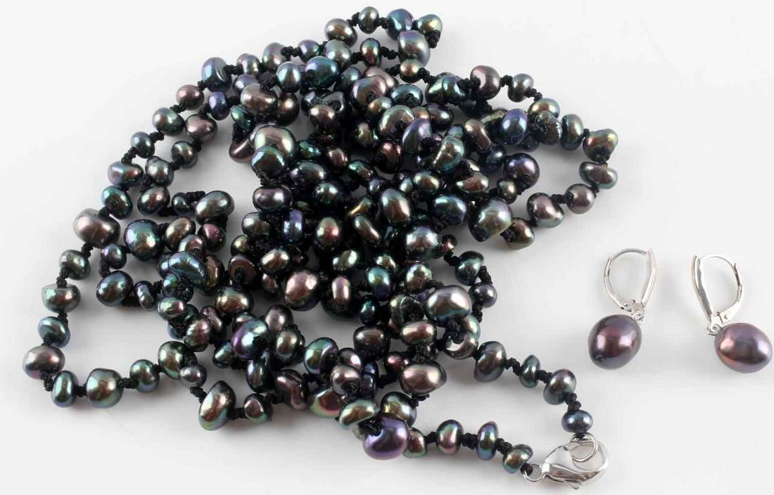 TAHITIAN BLACK BAROQUE PEARL NECKLACE & EARRINGS: Honora Baroque pearls (5-10mm), Tahitian black, individually knotted, length 60 inches with sterling silver clasp hallmarked 925 H. Pearl drop earrings 11mm each hallmarked 925 H.