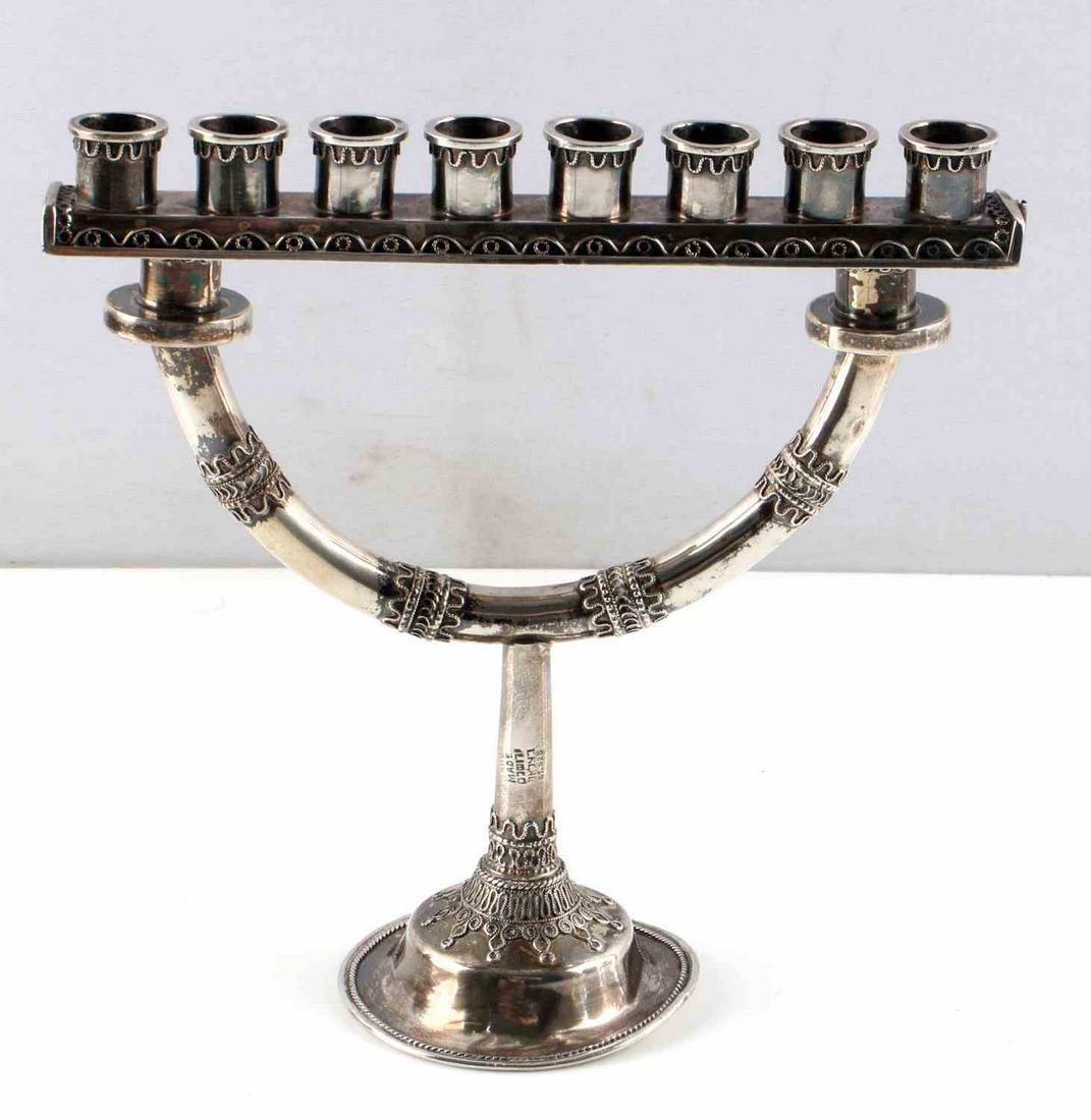 STERLING SILVER JEWISH HANUKKAH LAMP MENORAH: Hanukkah lamp with elaborate silverwork, indentations on bottom of stand, Hallmarked sterling silver, height 6 inches, width 6 inches Total weight 131.8.