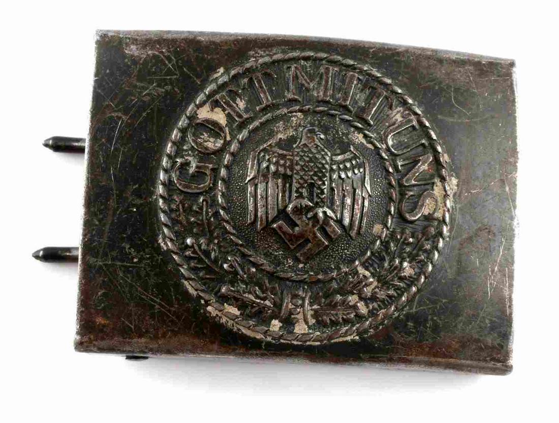 WWII THIRD REICH GERMAN ENLISTED MAN BELT BUCKLE: WWII German army enlisted man's belt buckle with "GOT MIT UNS" design on front measuring at 2 1/2 inches wide by 2 inches tall. Includes two prongs and belt hook on reverse side. Unauthenticated, sold