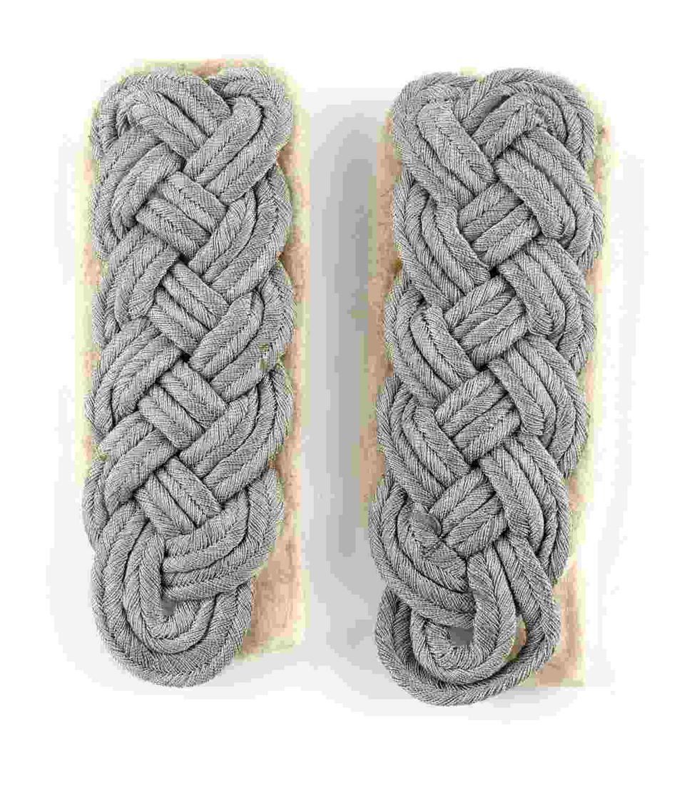 WWII GERMAN THIRD REICH OFFICER SHOULDER BOARDS: A pair of Third Reich officer's shoulder boards. Fluorescing and measure 4 x 1/3 inches. Unauthenticated, sold as is.