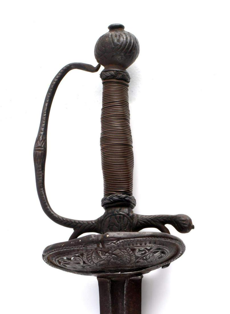 ANTIQUE ENGRAVED BRITISH COURT SWORD OPEN WORK: Features a 34.25 inch blade, VIEVL VT marked to center of one side of blade, open scroll work to guard cover, woman's bust to guard and pommel, wire wrapped grip. Top of D-grip is detached but fits ni