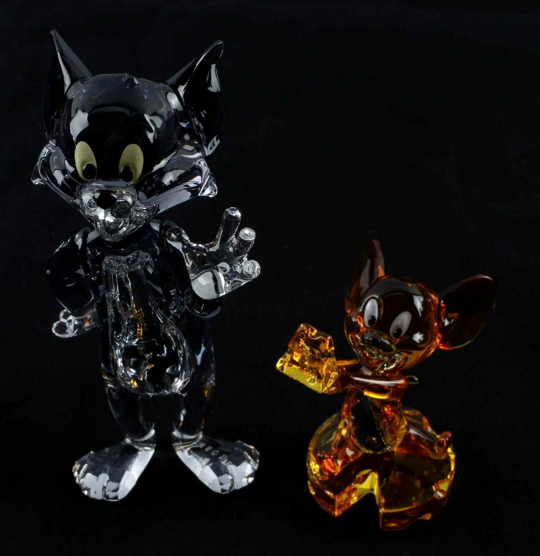 SWAROVSKI TOM AND JERRY CRYSTAL FIGURINES: Official Swarovski Tom and Jerry figurines in very good condition measuring 4 x 2 inches and 2 x 1 1/2 inches. No boxes included.