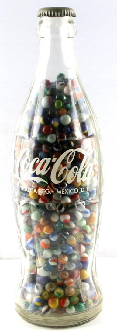 19" MEXICAN COCA COLA BOTTLE FULL ANTIQUE MARBLES: With original cap, oversize bottle filled with antique to recent say 1980's marbles, 100's with huge variety.