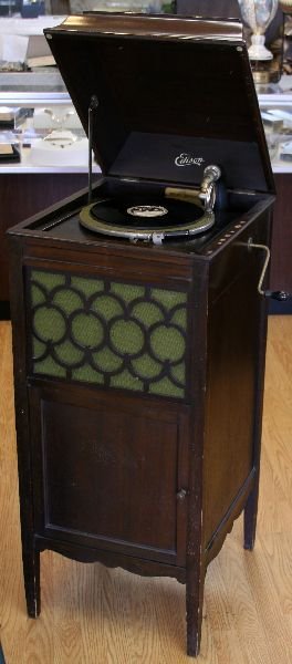 EDISON DISC PHONOGRAPH: Early 20th century disc phonograph made by Thomas Edison Inc. Applied makers name plate with "LU-37 SM36381" The case stands 43 x 17 x 20 inches and contains some thirty-one 10 inch discs. The case is