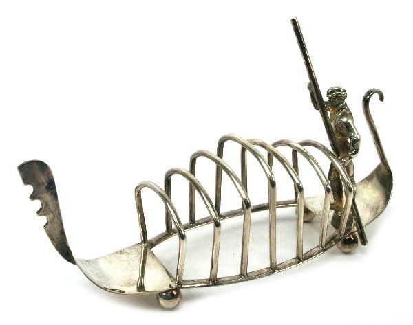 ANTIQUE VENETIAN GONDOLA E.P.N.S. TOAST RACK: An interesting electroplated nickel silver gondola toast rack circa 1930's.