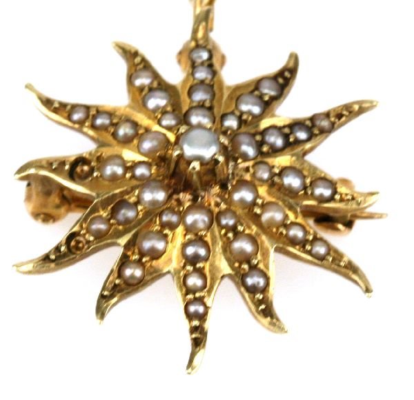ANTIQUE 14K GOLD NATURAL PEARL PIN/PENDANT: An antique 14K yellow gold pendant and necklace that can also be worn as a pin. Pendant has over 3 dozen small, natural pearls. Chain measures 16 inches. Total weight is 5.3 grams.