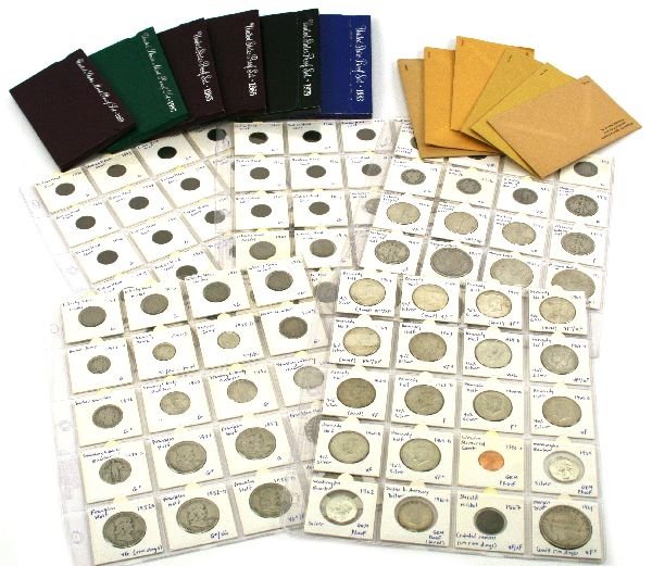 US COIN COLLECTION PROOF SETS OVER 100 COINS: A variety of US coins to include: 1960, 1961, (2) 1962, and (2) 1963 silver proof sets; 1979, 1983, (2) 1985, 1989, and 1997 clad proof sets. Also included are 4 silver Kennedy halves, 9 clad coins, p
