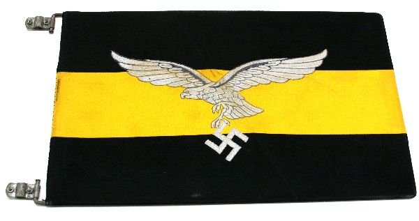 THIRD REICH LUFTWAFFE FLIGHT BATTALION CAR PENNANT: THIRD REICH LUFTWAFFE FLIGHT BATTALION CAR PENNANT Rectangular pennant of 15 x 9.5 inches. Embroidered eagle and swastika to black and yellow backing, fitted to a metal frame. EST. $300 - 500