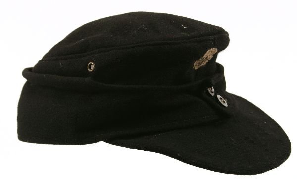 WWII GERMAN SS ENLISTED MANS M43 FIELD CAP: WWII GERMAN SS ENLISTED MANS M43 FIELD CAP Black wool/rayon field cap for a member of the Waffen SS. Replacement BeVo skull badge to the front. Some moth and wear holes (at least 9). The liner stamped