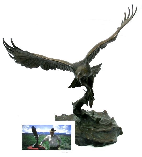 CLARK BRONSON BRONZE "MAJESTIC FISHERMAN" LTD EDN: CLARK BRONSON BRONZE "MAJESTIC FISHERMAN" LTD EDN A limited edition 1982 bronze statue by Clark Bronson. 44/75. A bald eagle with a fish in its talons titled "Majestic Fisherman." Measures 23 inches a