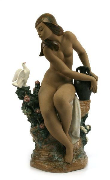 LIMITED EDITION LLADRO PORCELAIN NUDE WITH DOVE: LIMITED EDITION LLADRO PORCELAIN NUDE WITH DOVE A beautifully hand crafted Lladro #3503 depicting a young girl sitting on a bench with roses and a single white dove. The Lladro is marked number 875 ou