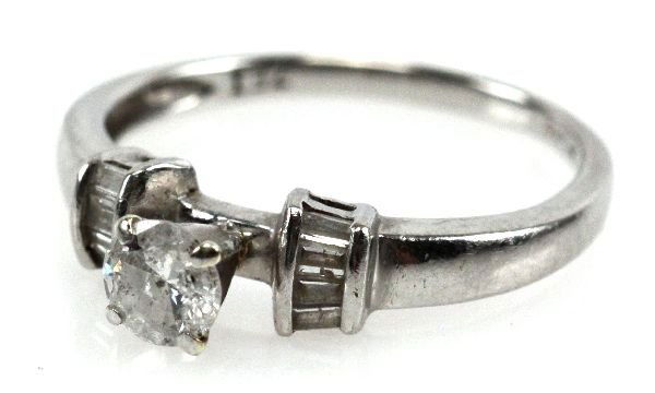 1/2 CT DIAMOND & PLATINUM ENGAGEMENT RING: 1/2 CT DIAMOND & PLATINUM ENGAGEMENT RING A ladies 1/2 ct diamond engagement ring. Set in platinum with baguettes on each side of the 1/2 ct. Diamond is approximately SI-2 to I-1 clarity and I color.
