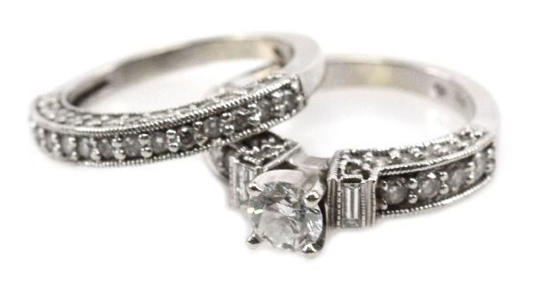 14K WHITE GOLD 1/2 CT DIAMOND WEDDING SET: 14K WHITE GOLD 1/2 CT DIAMOND WEDDING SET A beautiful ladies diamond wedding set in 14K white gold. 1/2 ct center stone with 38 smaller diamonds. Band has 42 small diamonds. A combined total carat wei