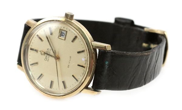 MENS OMEGA AUTOMATIC DE VILLE WRISTWATCH: MENS OMEGA AUTOMATIC DE VILLE WRISTWATCH A circa 1960's men's 35mm Omega De Ville with 1012 caliber automatic movement. Watch features a gold stainless steel case with gold tone face, raised gold and 