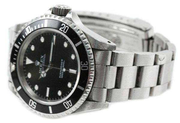 MENS STAINLESS STEEL ROLEX SUBMARINER - US NAVY: MENS STAINLESS STEEL ROLEX SUBMARINER - US NAVY C1995, stainless steel Rolex wristwatch with a 39mm case. SN S584010. Rolex bracelet. Black dial with white enameled point type numerals. Baton hour, mi