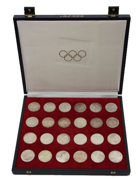 1972 MUNICH OLYMPICS 24 SILVER COINS: 1972 MUNICH OLYMPICS 24 SILVER COINS A set issued by the International Olympic Coin Centre each coin weighing .50 troy oz. in silver ,24 total coins in original presentation case. EST. $200 - 400