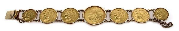 INDIAN HEAD GOLD COIN BRACELET 7 COINS: INDIAN HEAD GOLD COIN BRACELET 7 COINS A 7 inch bracelet with 7 Indian head gold coins set in 14K gold. The center coin is a 1915 $10 eagle. Next to it are 2 1909 D $5 half eagles and 2 1909 $5 half e