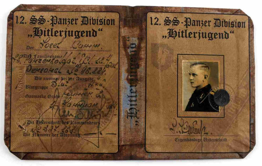 WWII GERMAN REICH SS AUSWIES ID TO HITLERJUGEND: WWII German reich SS auswies ID booklet to HitlerJugend member from SS Panzer Division. Unauthenticated, sold as is. This lot has a reserve.