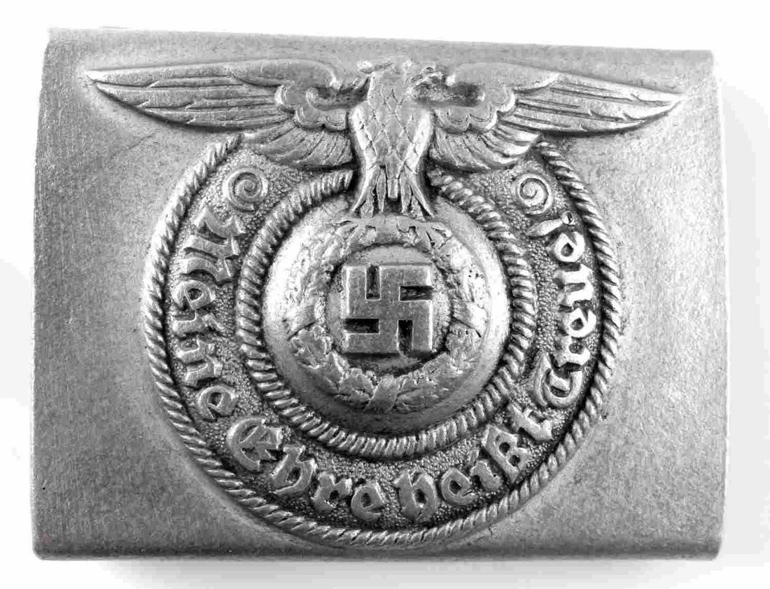 WWII GERMAN THIRD REICH SS ENLISTED BELT BUCKLE: WWII German Reich SS enlisted man's belt buckle measuring 1 13/16 inches tall by 2 3/8 inches wide. Reverse side of belt buckle features both prongs and is marked "RZM", "SS", and "822/37". In good co