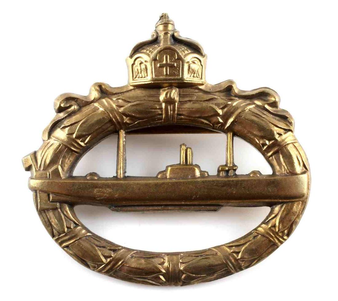 WWI GERMAN MASSIVE TYPE U BOAT BRASS BADGE: WWI German U-boat brass badge. Stamped Walter Schott fec on reverse. Measures 2 inches diameter. This lot has a reserve.