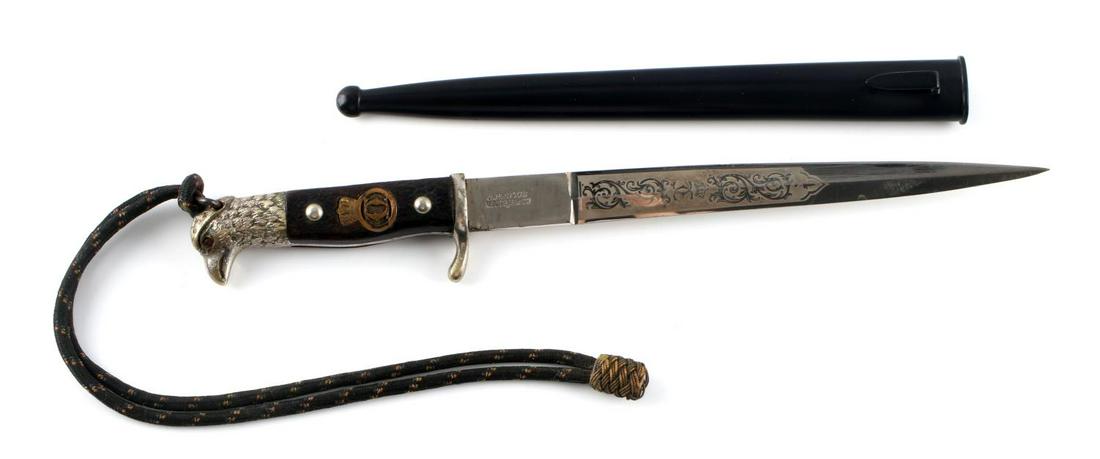 WWII ROMANIAN OFFICER DAGGER RUBY EYE EAGLE: A Romanian dagger from WWII with metal scabbard. Measures 11 1/2 inches. Marked E. & F. Horster. Antler grip. Scabbard exterior is in very good condition with interior rust. Blade has scratches and mi