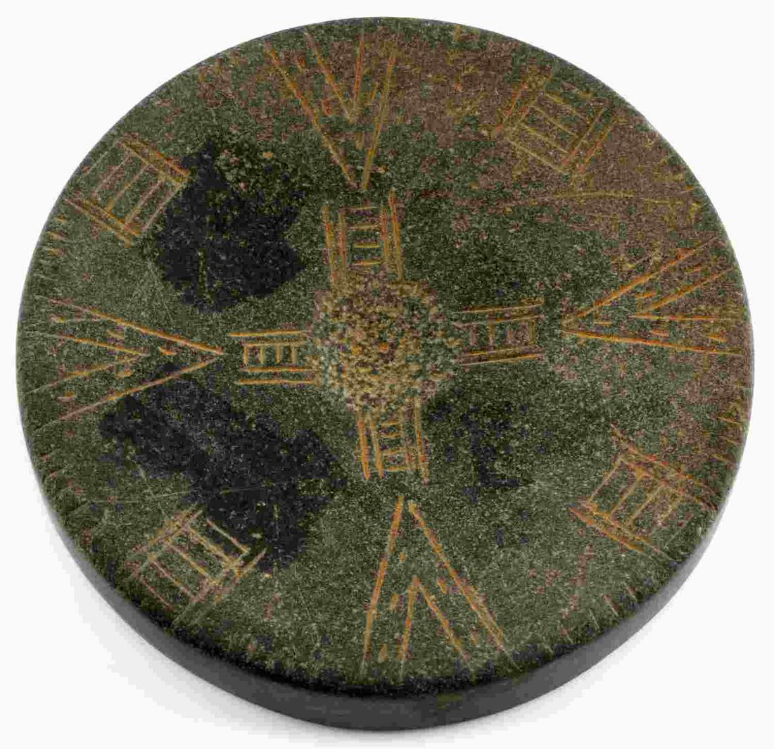 NATIVE AMERICAN HOPEWELL PIPESTONE DISK W CROSS: A Native American Hopewell tribe disk handcrafted from pipestone. Features the same design on both sides. Cross in the middle with rectangles and triangles on the edges. Measures 4 inches diameter. Fo