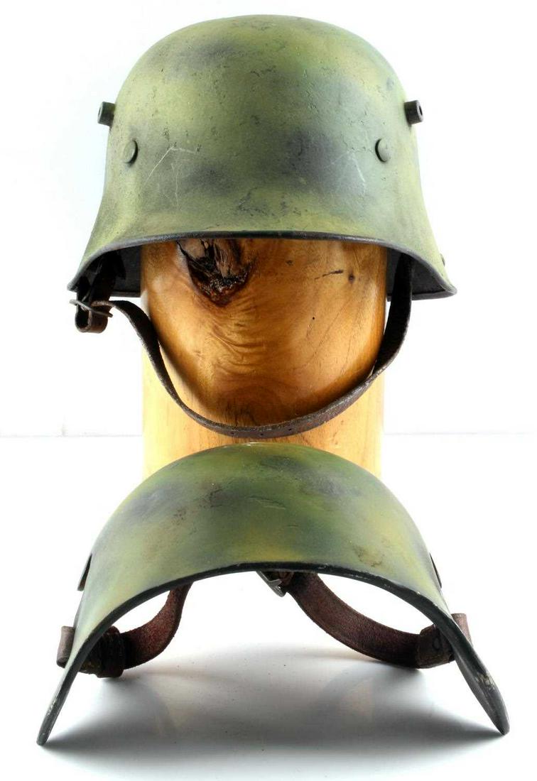 WWII GERMAN THIRD REICH M17 HELMET W BLAST SHEILD: A WWII Third Reich Imperial German painted M17 helmet with blast shield. 8 tongue leather liner pliable with slight rotting. Paint has been restored to original condition. Overall very good condition.