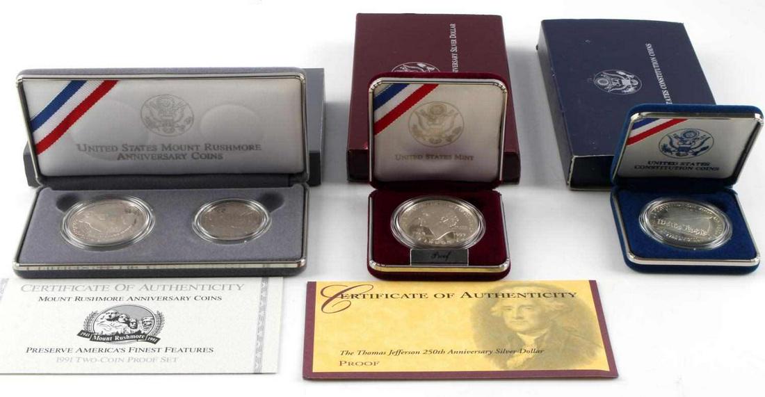 US MINT COMMEMORATIVE SILVER DOLLAR PROOF COIN LOT: Lot of silver Commemorative coins includes 1991 US Mount Rushmore Anniversary proof coins, US Constitution 200th Anniversary coin, Thomas Jefferson 250TH Anniversary Silver Dollar Proof. All as issued
