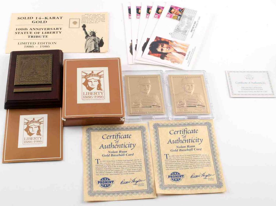 GOLD NOLAN RYAN ELVIS FDC 14K STATUE OF LIBERTY: Misc. lot , includes 2 Nolan Ryan gold baseball cards, 14 kt gold 9mm coin, 6 Elvis FDC .29 cent postcards, Statue of Liberty bronze stamp plaque.
