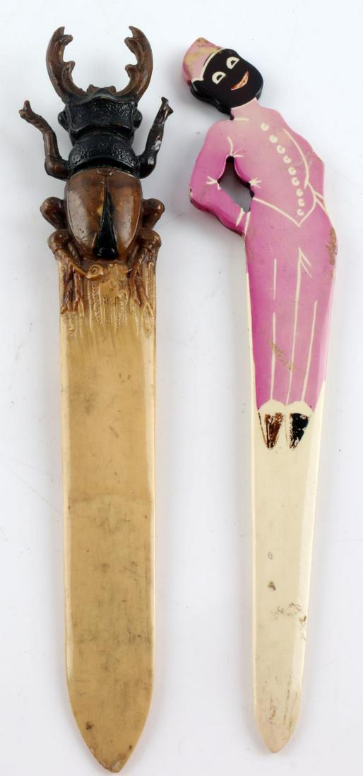 LOT OF 2 UNIQUE CELLULOID LETTER OPENERS BEETLE: One beetle letter opener, and one black americana letter opener, 8 inches long. Good condition.
