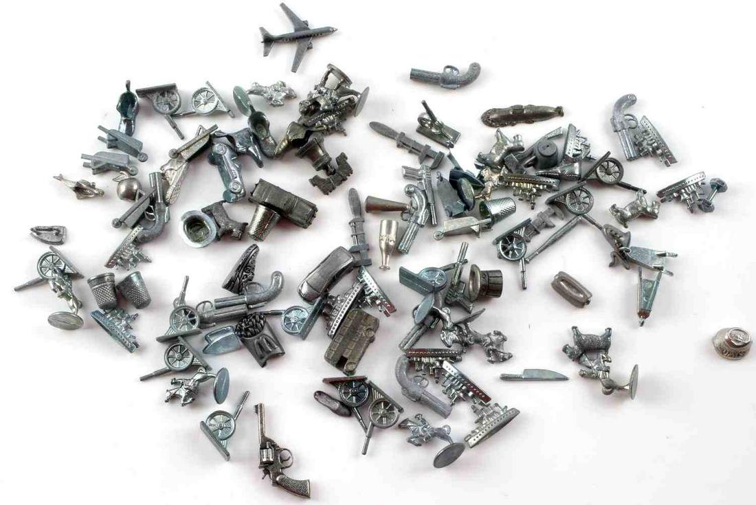 VINTAGE MONOPOLY BOARD GAME PIECES LOT OF 100: Assorted vintage and special edition Parker Bros. and Hasbro Monopoly game board pieces in pre-owned condition.