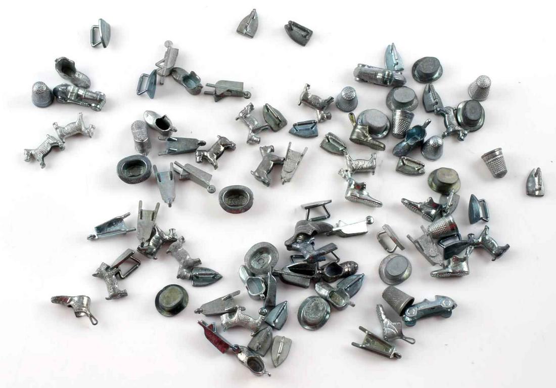 VINTAGE MONOPOLY BOARD GAME PIECES LOT OF 90: Assorted vintage and special edition Parker Bros. and Hasbro Monopoly game board pieces in pre-owned condition.
