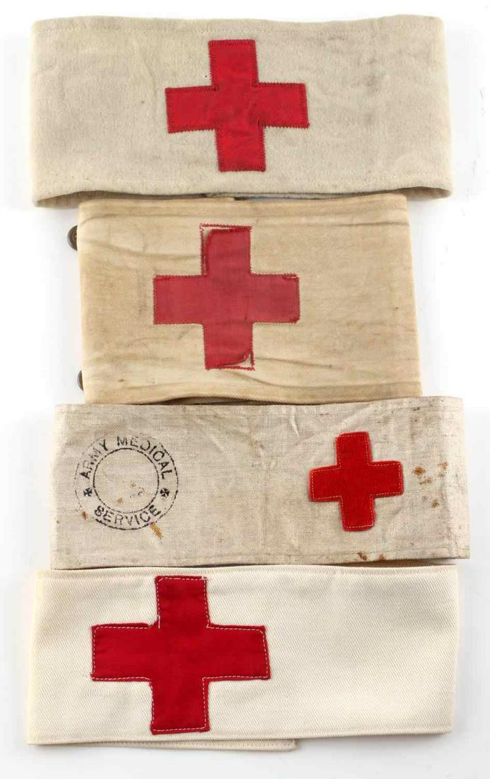 LOT OF 4 WWII U.S. MILITARY ARMY MEDIC ARM BANDS: 4 WWII U.S. Army medic armbands. Measure 181/4 inches. Made of wool or cotton. Some fluoresce. Minor age wear. Very good condition.