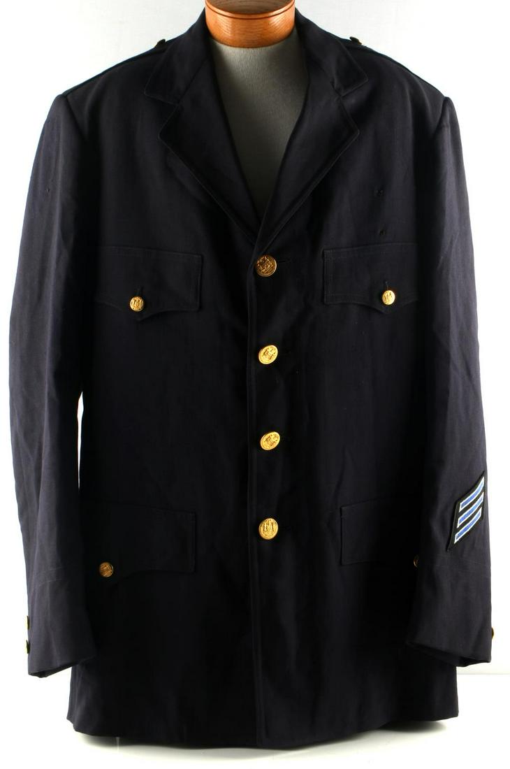 VINTAGE NEW YORK CITY POLICE DRESS JACKET TUNIC: Blue wool jacket with satin interior, size large, 1864 gold buttons, rank patch to left cuff. Label to inside, named to James B. Mulvaney. Good condition.