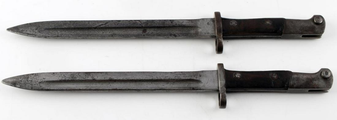 WWII AUSTRIAN 1912 BAYONETS LOT OF 2 CE WG MARKED: Each features a 10 inch blade, CE WG marked to ricasso, wood grips, and steel fittings. Scattered patina, but smooth to touch. Good condition.