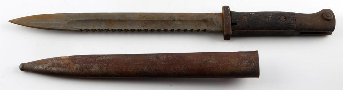 WWI GERMAN BUTCHER BLADE K-98 SAWBACK BAYONET: WWI K-98 sawback bayonet. Deutsche Maschinenfall A-G marked. Measures 15 1/4. Blade and scabbard feature heavy oxidation. No dents or scratches. Bayonet mount is frozen.
