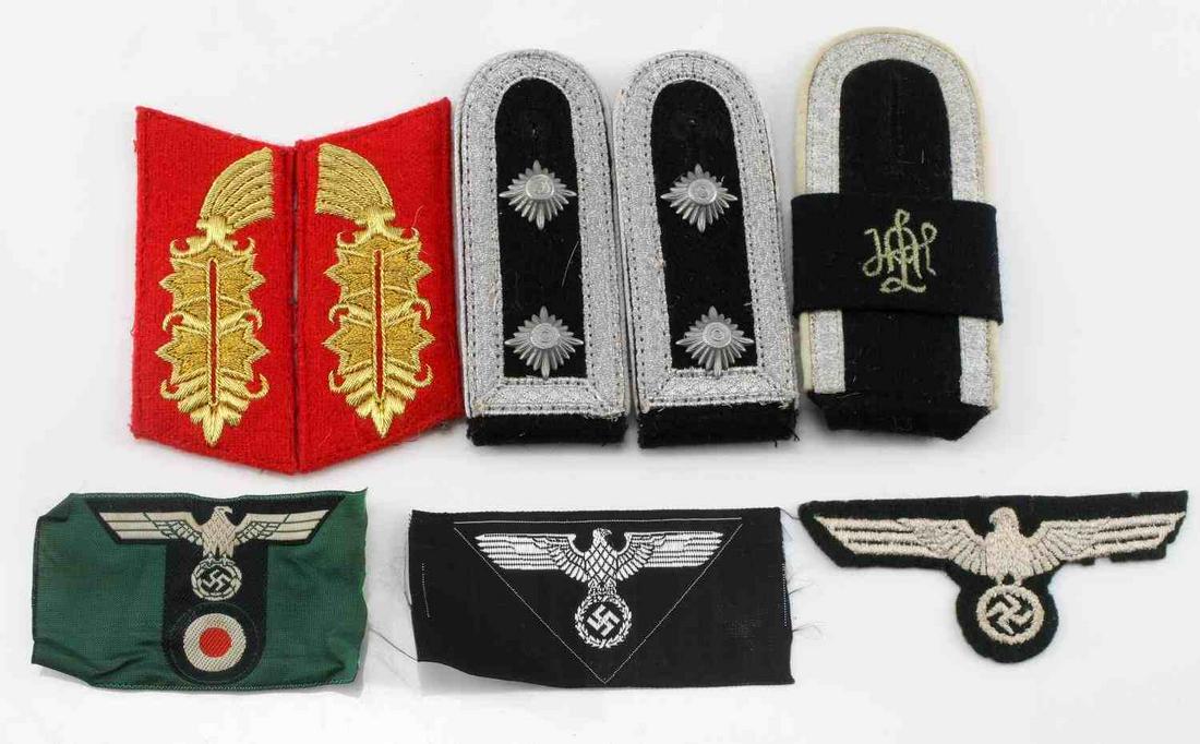 WWII GERMAN THIRD REICH LOT OF PATCHES & WEARABLES: Lot of German Shoulder Boards, Patches, and Collar Tabs. Very good condition. Includes a pair of Wehrmacht shoulder boards with 2 pips, an unidentified monogrammed shoulder board, a pair of red West G