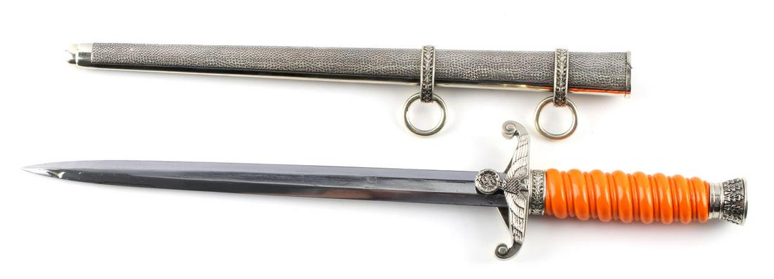 WWII GERMAN HEER ARMY BOKER DAGGER WITH SCABBARD: WWII German army Heer dagger with scabbard. Orange bakelite grip. Nickel oak leaf and acorn pommel and and crossguard. oak leaf ring above crossguard. Eagle to crossguard. 9 3/4 inch blade maker marke