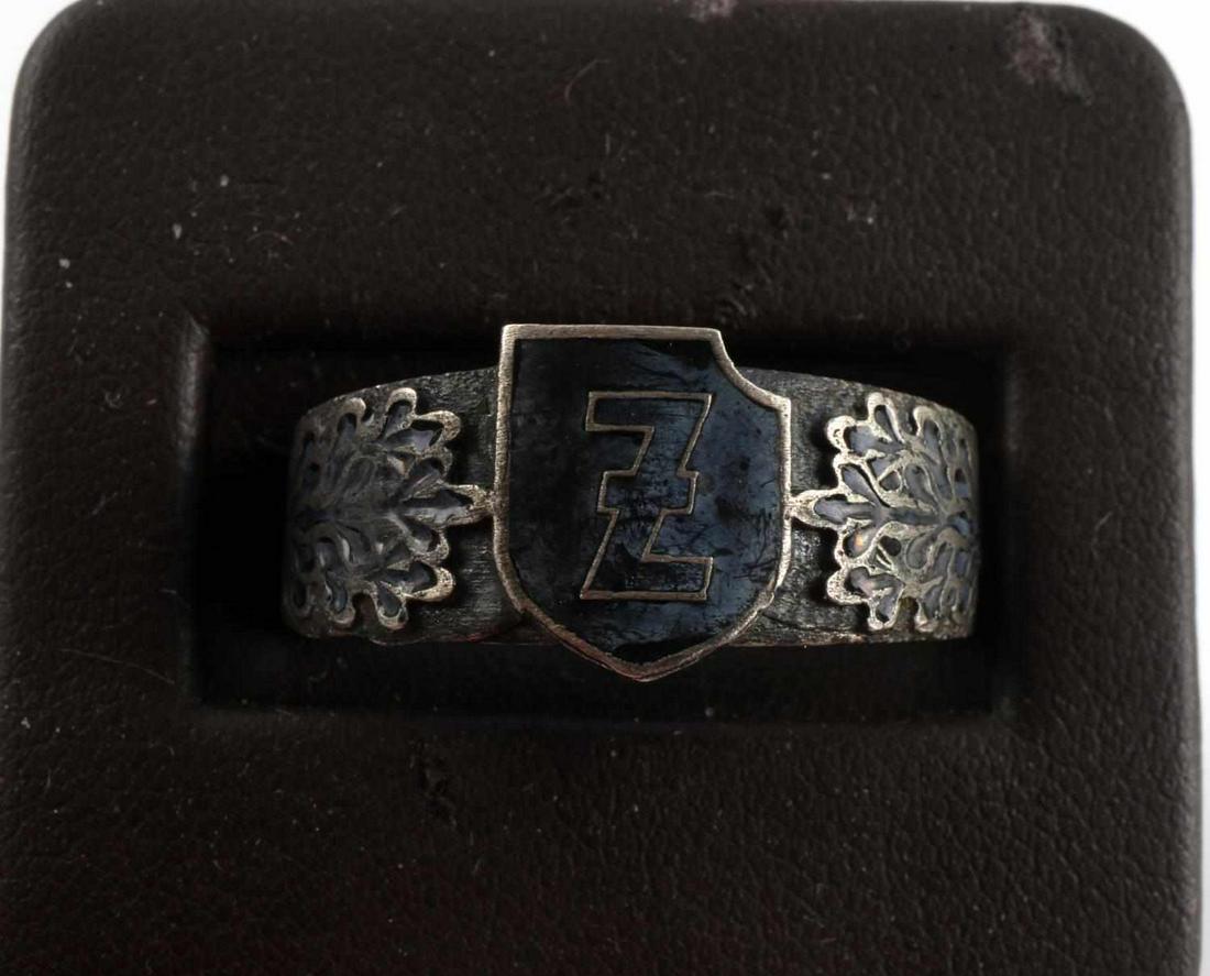 WWII GERMAN WAFFEN SS 2ND PANZER DAS REICH RING: Metal ring with enamel Z to front and oak leaves out to sides, RZM and Himmler inscription inside band, size 12.5, Polizei marked to rear. Good condition. Unauthenticated, sold as is.