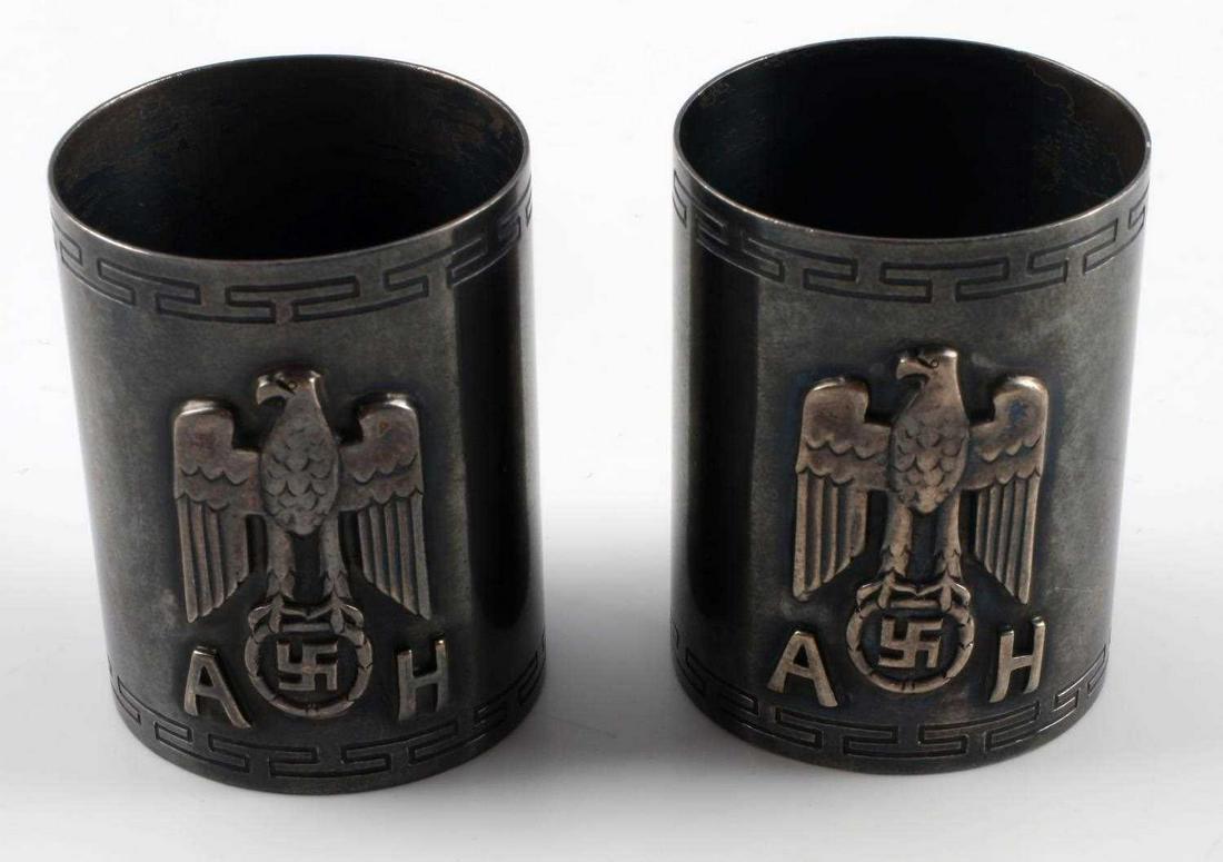 PAIR OF WWII GERMAN ADOLF HITLER NAPKIN RINGS: Reichsadler and Hitler's initials in relief to front, marked half moon, 800 to rear. Silver plate construction. Good condition. Unauthenticated, sold as is.