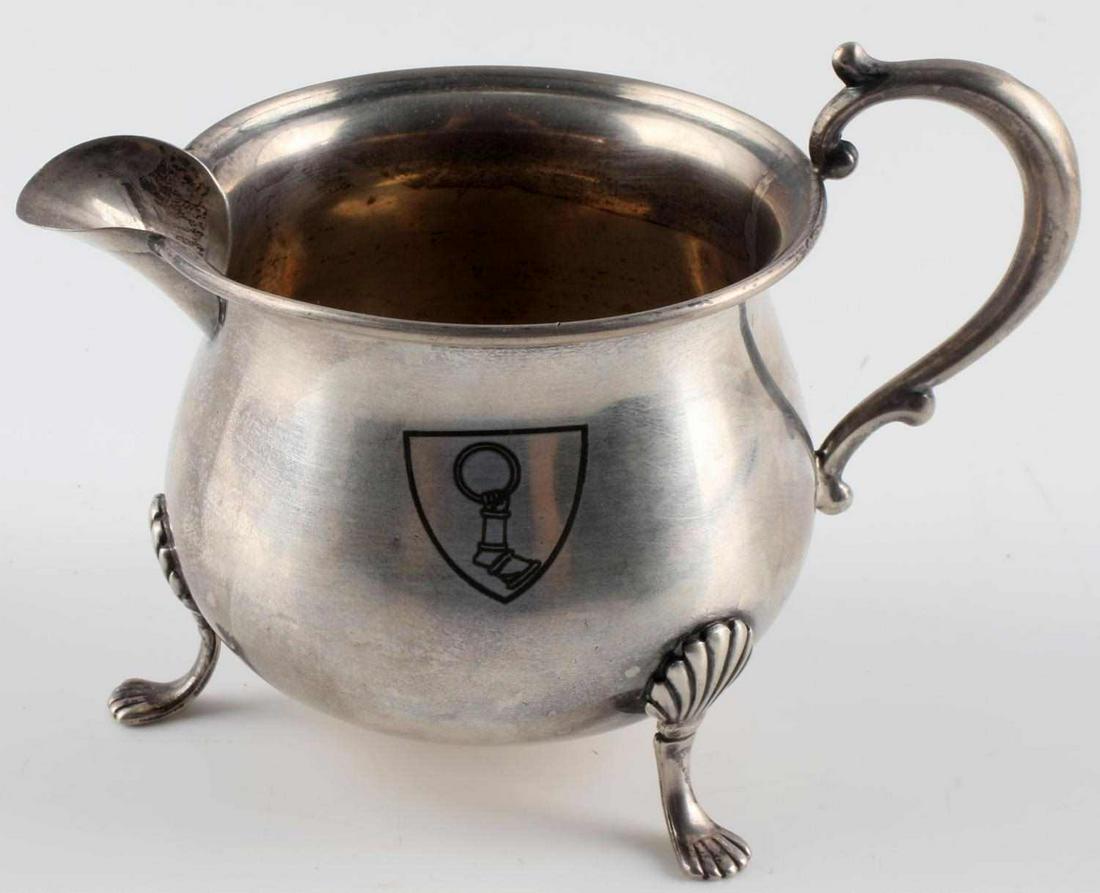 WWII GERMAN HERMANN GOERING STERLING CREAMER CUP: WWII German Hermann Goering sterling creamer cup. Features Goering's insignia on the front. "Empire Sterling 28" marked on the bottom. Measures approximately 2.5 inches tall, with the opening at the t