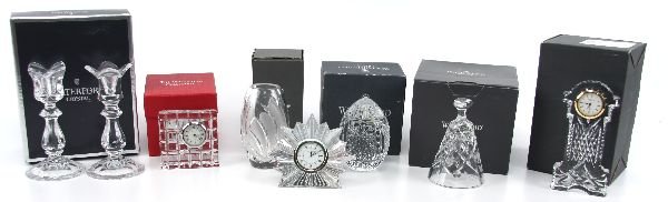 WATERFORD CRYSTAL LOT VASE CLOCK AND MORE: 69007 WATERFORD CRYSTAL LOT VASE CLOCK AND MORE Included is a 5 inch tall cut and etched vase (boxed), a 1986 Christmas bell, a 4 inch tall egg paperweight, a pair of 6 inch candlesticks, a 6 inch "Gr