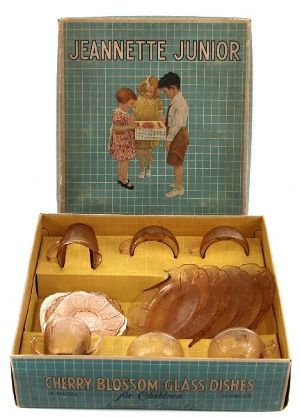 JEANNETTE JUNIOR CHERRY BLOSSOM GLASS DINNER SET: 69018 JEANNETTE JUNIOR CHERRY BLOSSOM GLASS DINNER SET A Jeannette Junior 13 piece pink cherry blossom dinner set. Set includes 4 plates, 4 cups, 3 saucers, a creamer, and a sugar bowl. Set is in very