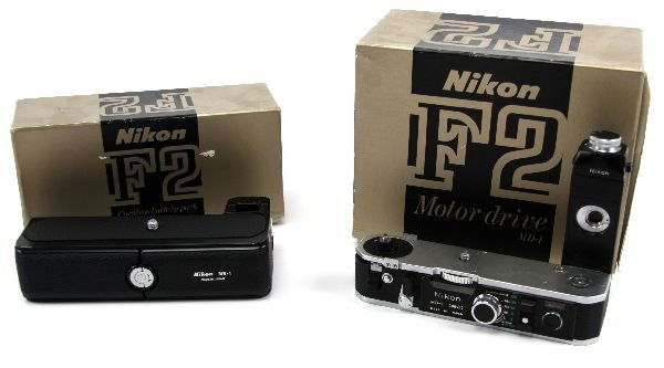 NIKON F2 CAMERA EQUIPMENT LOT MD-1 MB-1 IN BOX: 69031 NIKON F2 CAMERA EQUIPMENT LOT MD-1 MB-1 IN BOX Lot includes the Nikon F2 Motor Drive MD-1 in original box as well as the Nikon F2 Cordless battery pack MB-1 in original box. Battery pack has a b